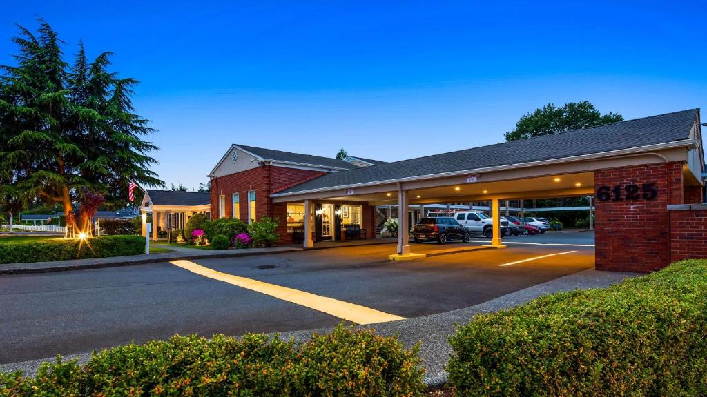 a building with a parking lot in front of it at Best Western Lakewood- Historic Landmark in Lakewood