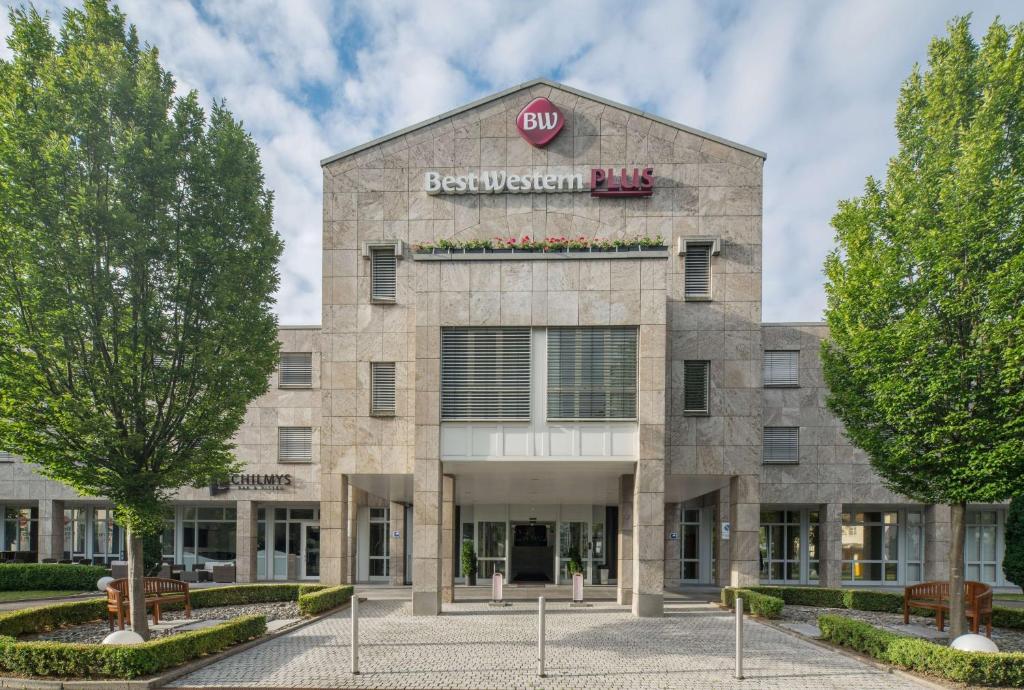 a building with a stop sign on it at Best Western Plus Hotel Fellbach-Stuttgart in Fellbach