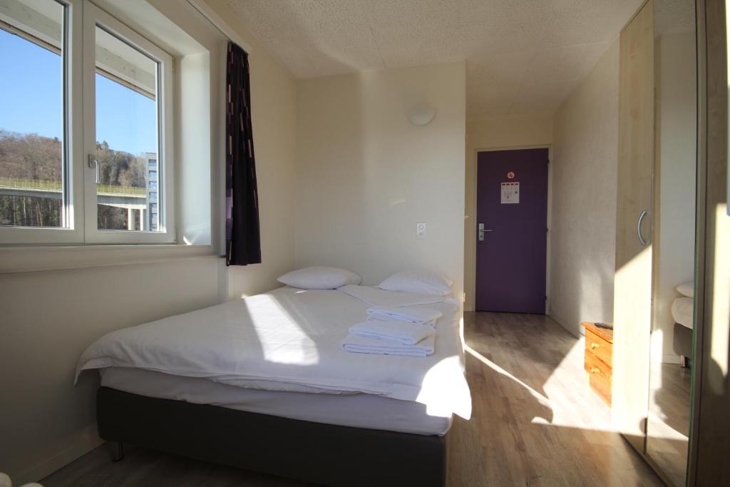 Postel nebo postele na pokoji v ubytování Hotel Abaca