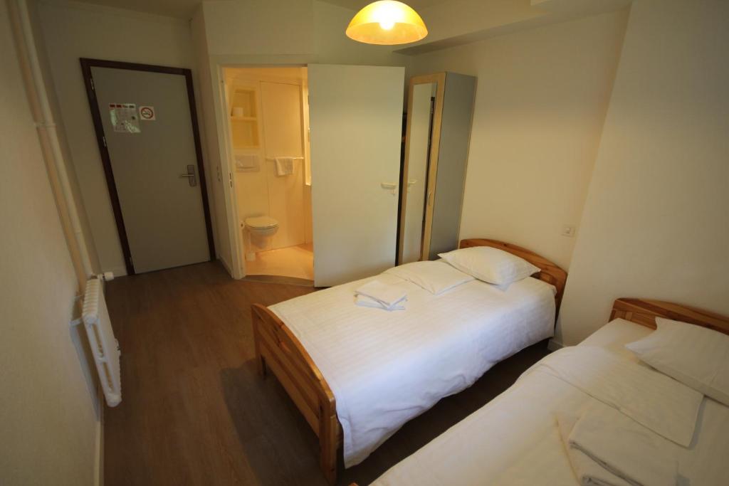Postel nebo postele na pokoji v ubytování Hotel Abaca