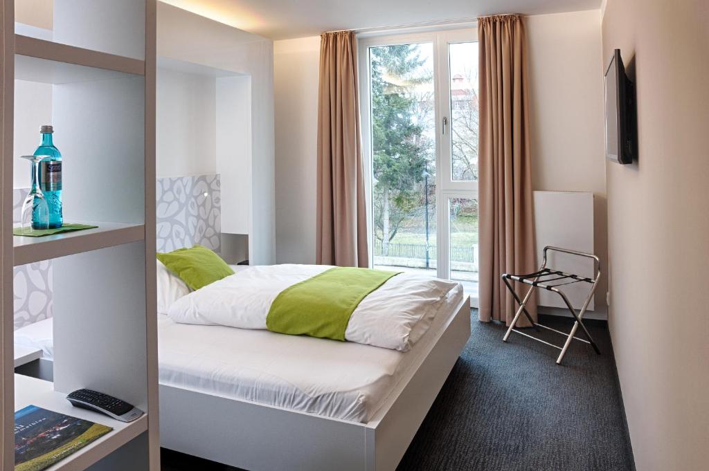Voodi või voodid majutusasutuse MARA Hotel toas