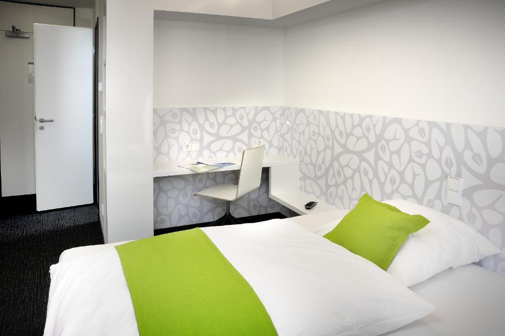 Voodi või voodid majutusasutuse MARA Hotel toas