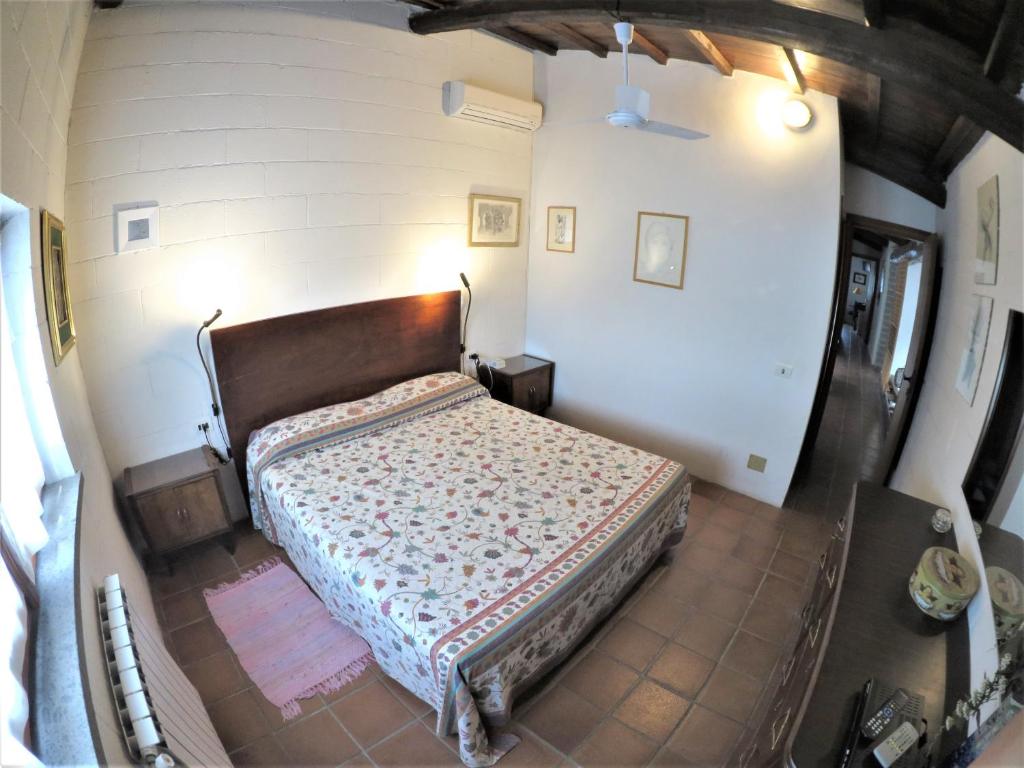 Łóżko lub łóżka w pokoju w obiekcie Poggiolindo B&B