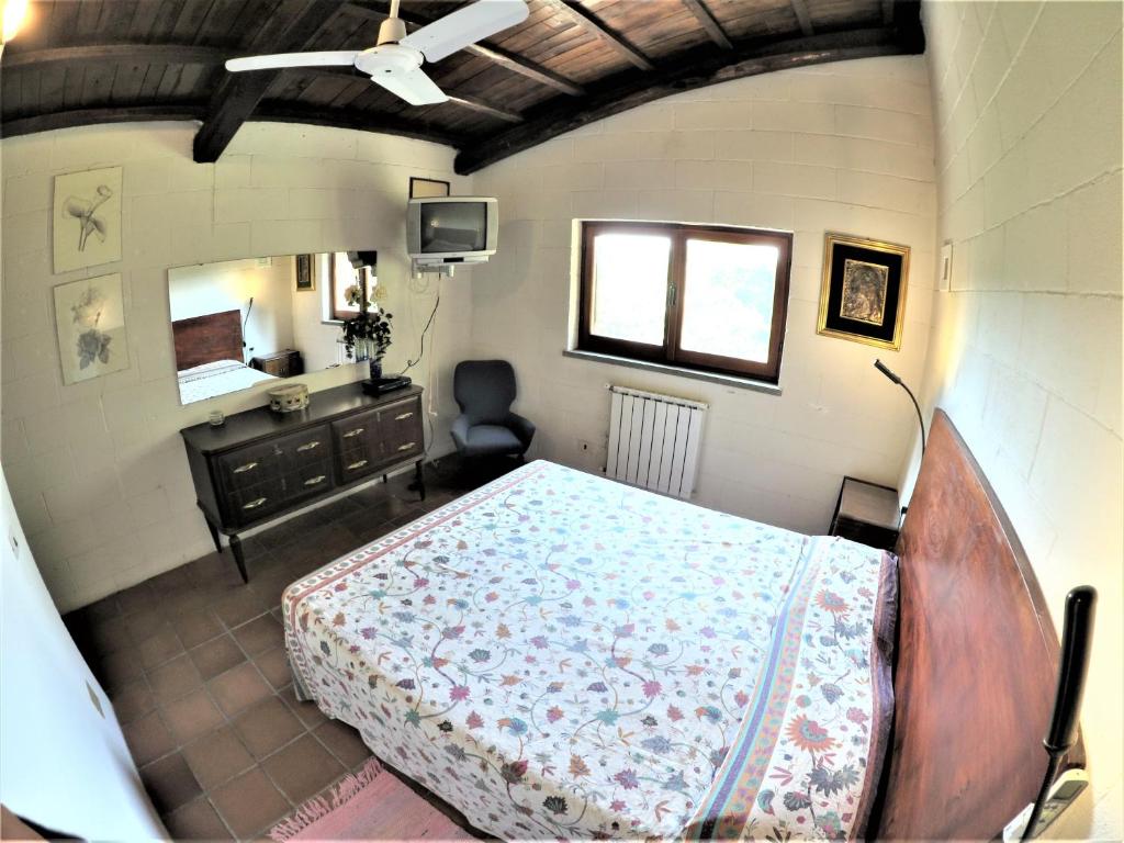 Łóżko lub łóżka w pokoju w obiekcie Poggiolindo B&B