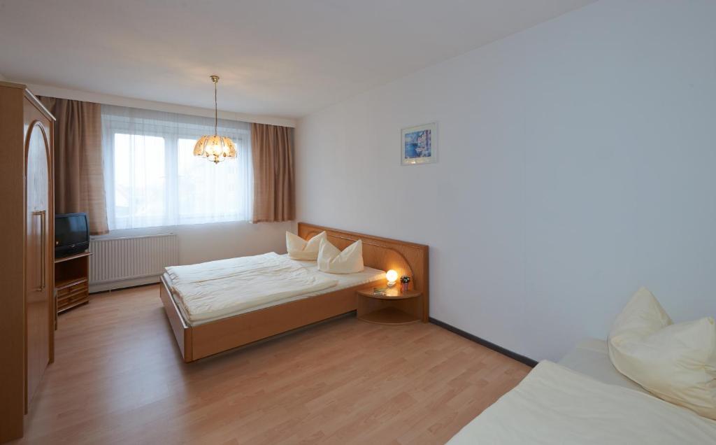 Postel nebo postele na pokoji v ubytování Alpha Apparthotel leipzig-Rötha