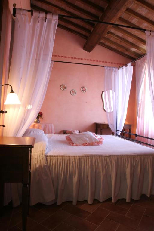 Postel nebo postele na pokoji v ubytování Agriturismo Renaccino