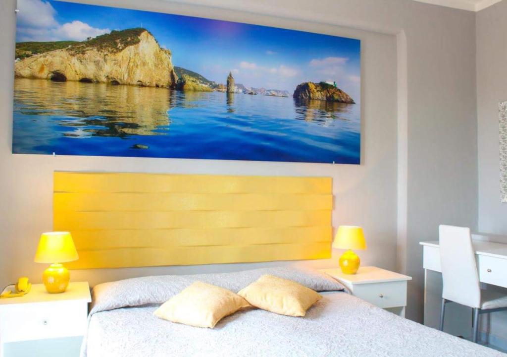 Postel nebo postele na pokoji v ubytování Hotel Ortensia