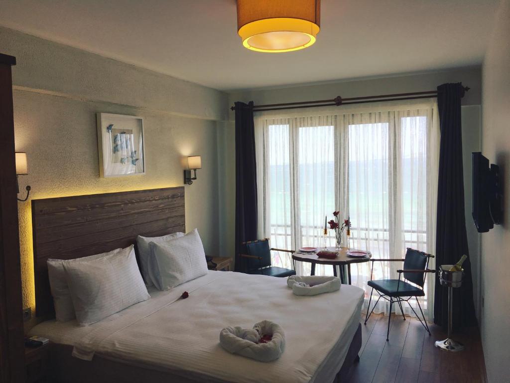 מיטה או מיטות בחדר ב-8 Rooms Hotel