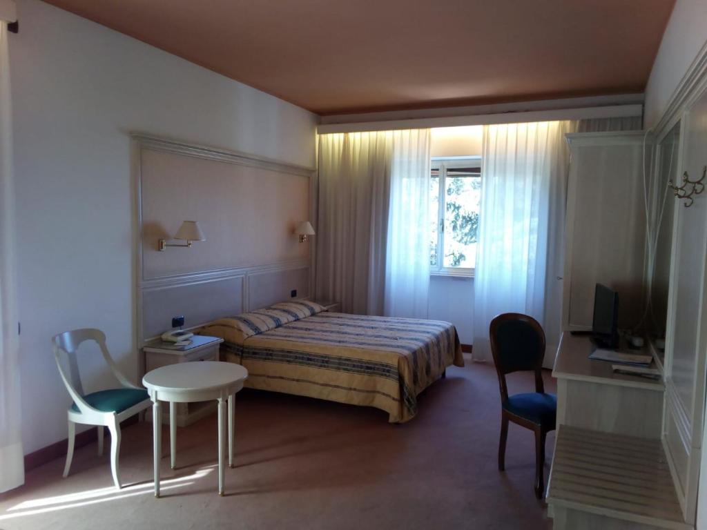 Postel nebo postele na pokoji v ubytování Balletti Park Hotel