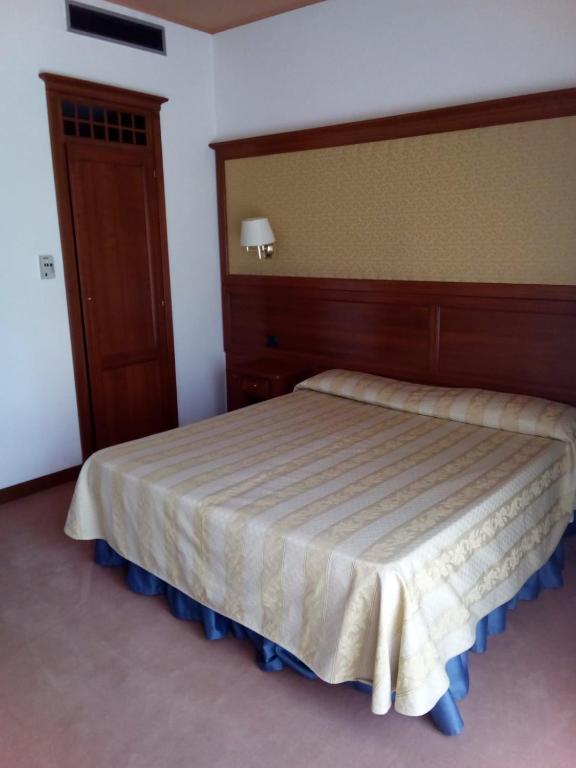Postel nebo postele na pokoji v ubytování Balletti Park Hotel