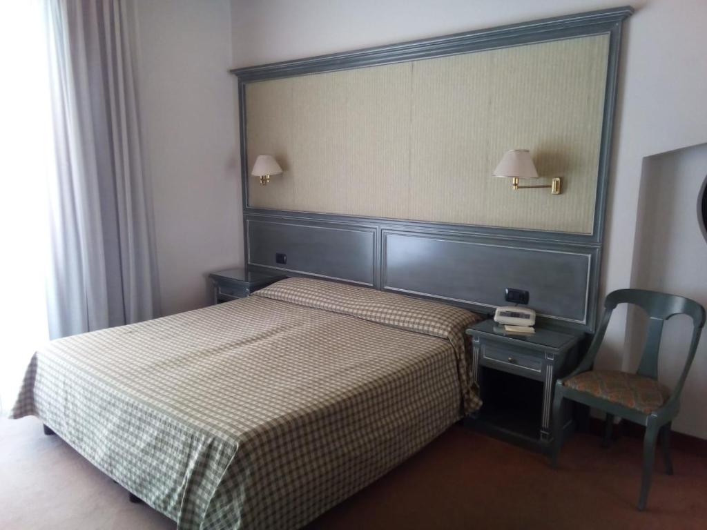 Postel nebo postele na pokoji v ubytování Balletti Park Hotel