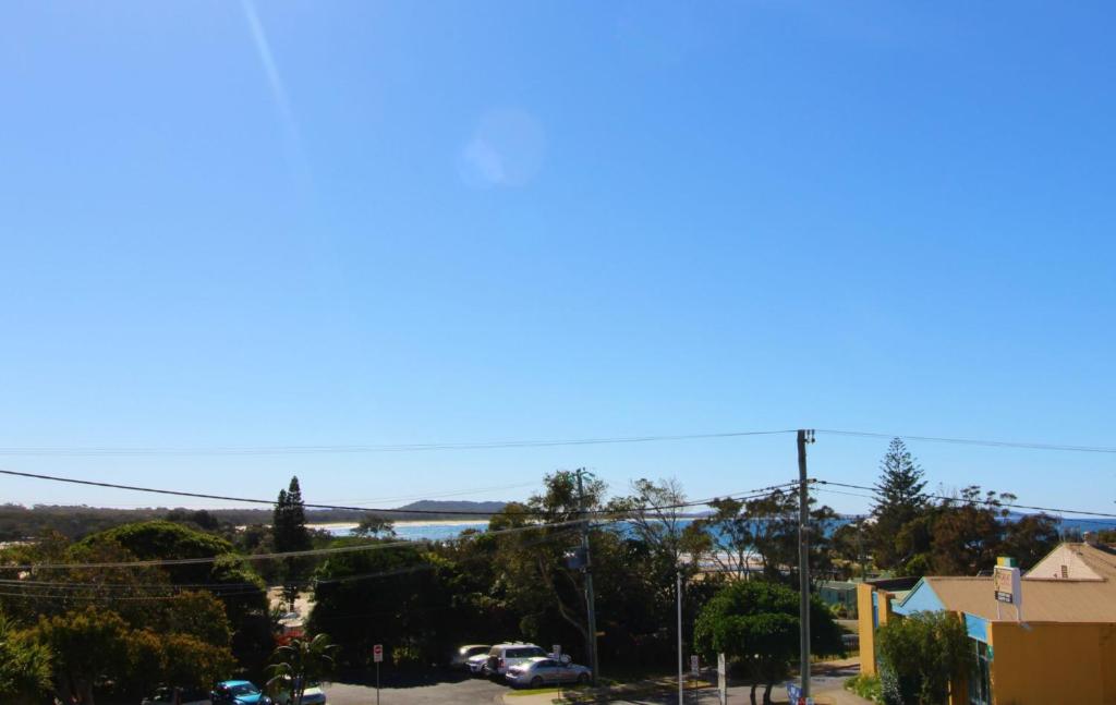 a view of the ocean from a street at Bombora, 3/4 East Street in Crescent Head
