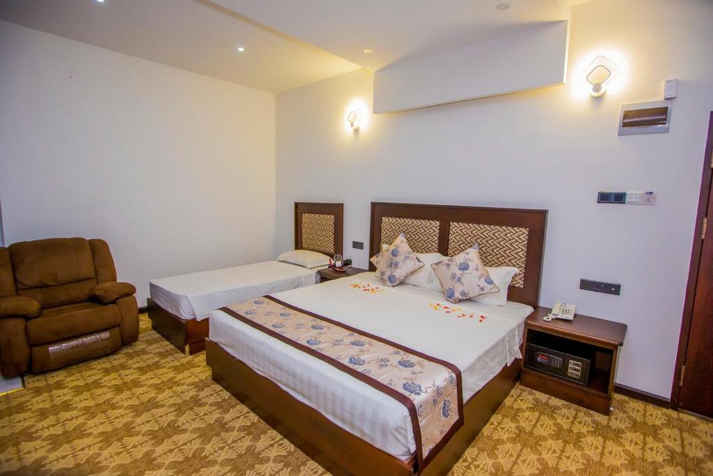 Postel nebo postele na pokoji v ubytování Euro Star Hotel