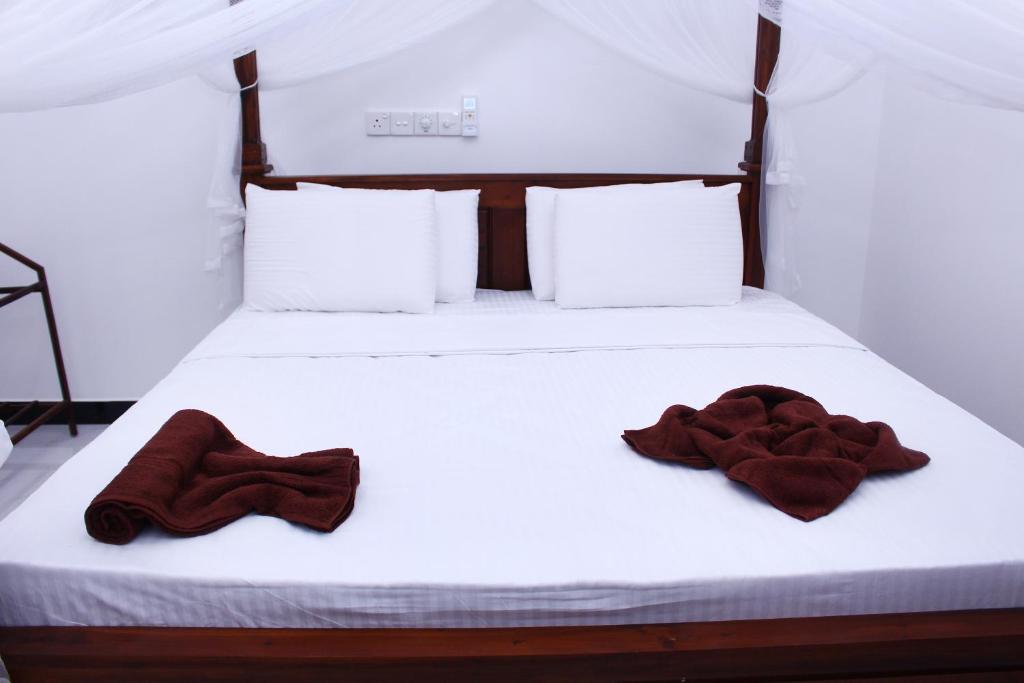 Postel nebo postele na pokoji v ubytování Amal Guest house