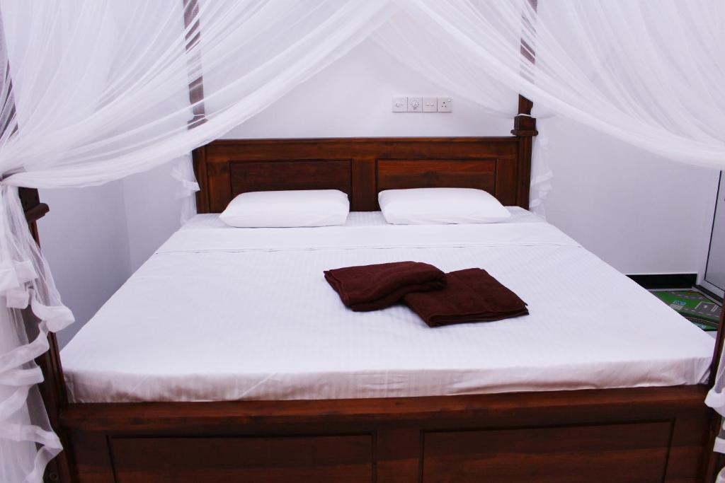 Postel nebo postele na pokoji v ubytování Amal Guest house