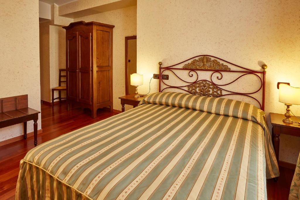 Postel nebo postele na pokoji v ubytování Liberty Hotel