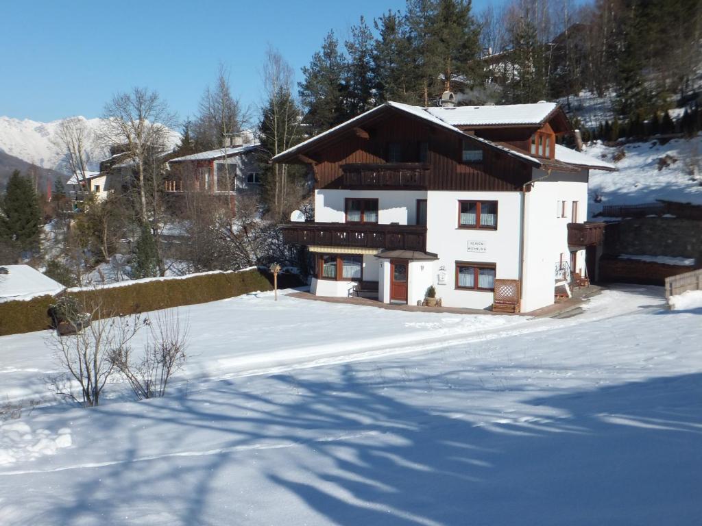 a house with snow on the ground in front at Haus Gantioler in Mieders