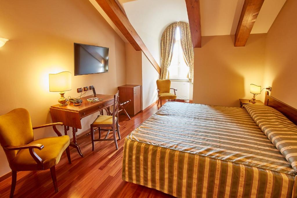 Postel nebo postele na pokoji v ubytování Liberty Hotel