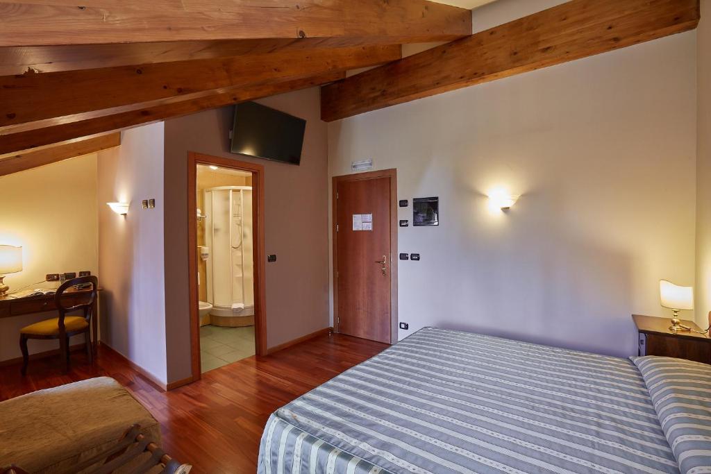 Postel nebo postele na pokoji v ubytování Liberty Hotel