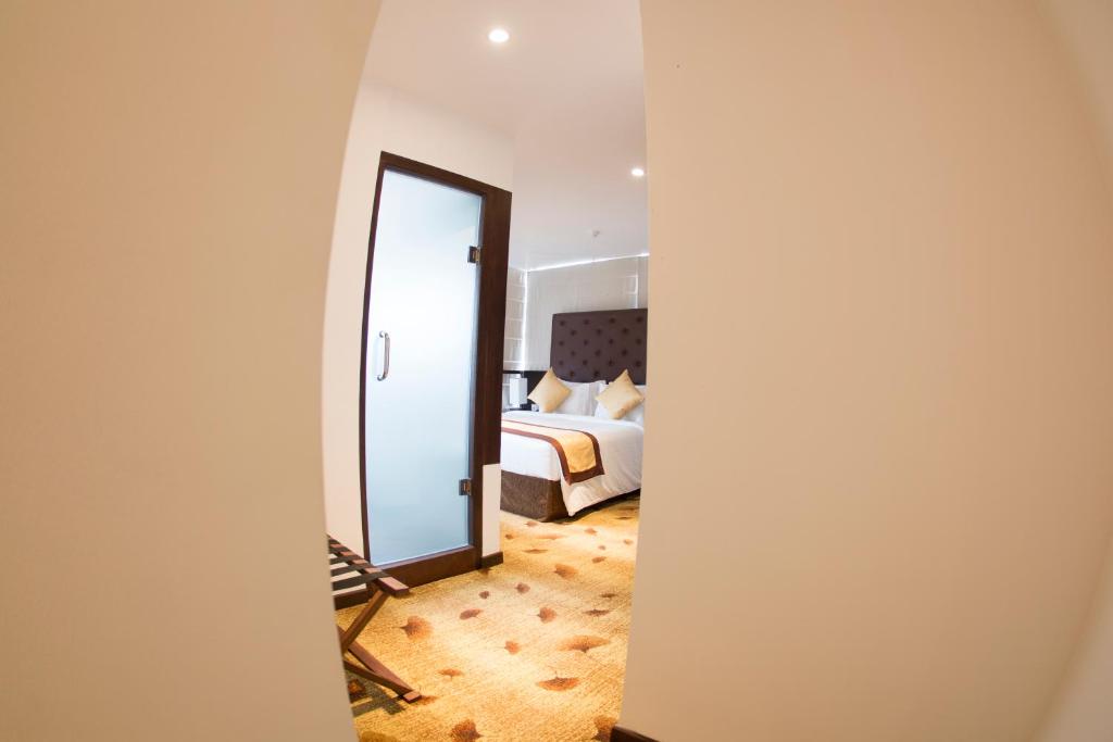 Postel nebo postele na pokoji v ubytování City Hotel Colombo 02
