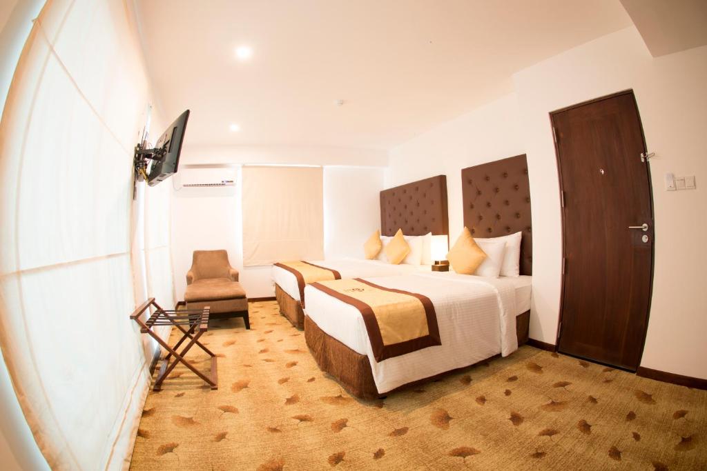Postel nebo postele na pokoji v ubytování City Hotel Colombo 02