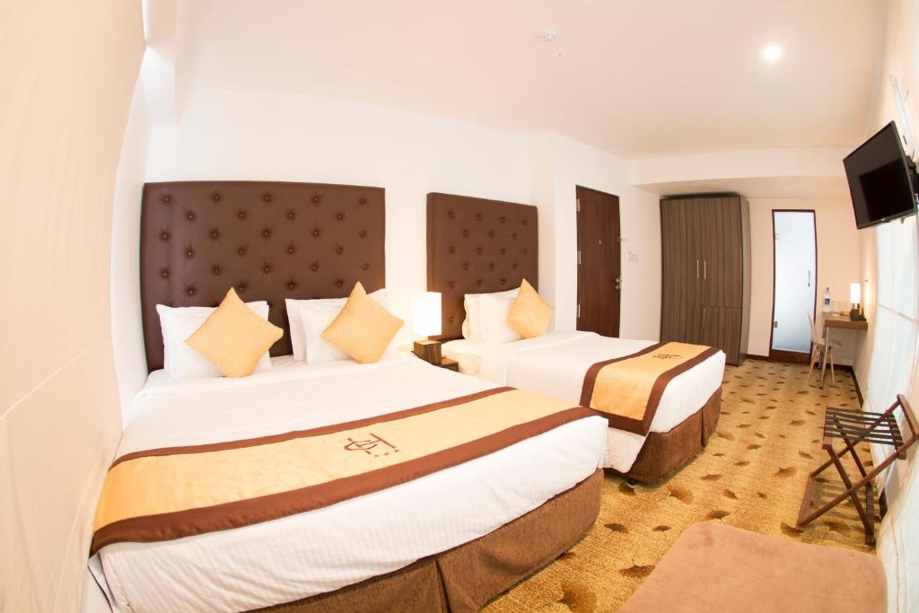 Postel nebo postele na pokoji v ubytování City Hotel Colombo 02