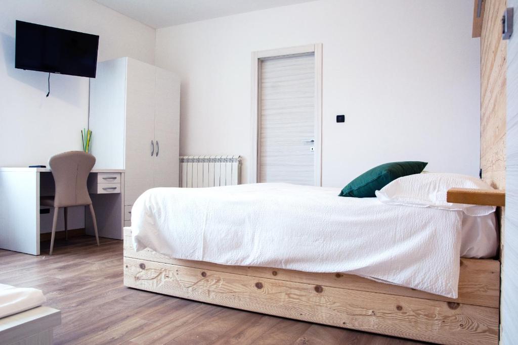 Postel nebo postele na pokoji v ubytování B&B Castello Cimbergo
