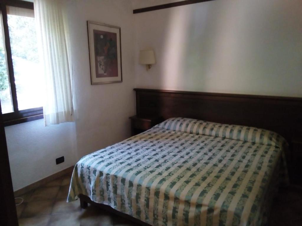 Postel nebo postele na pokoji v ubytování Balletti Park Hotel