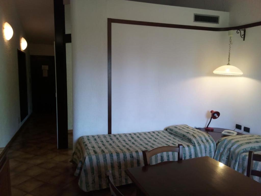 Postel nebo postele na pokoji v ubytování Balletti Park Hotel