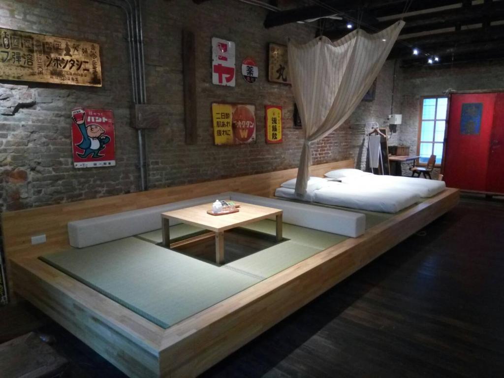 Postel nebo postele na pokoji v ubytování 和寂百年天井老房子包棟民宿wabisabi Japanese Entire Home