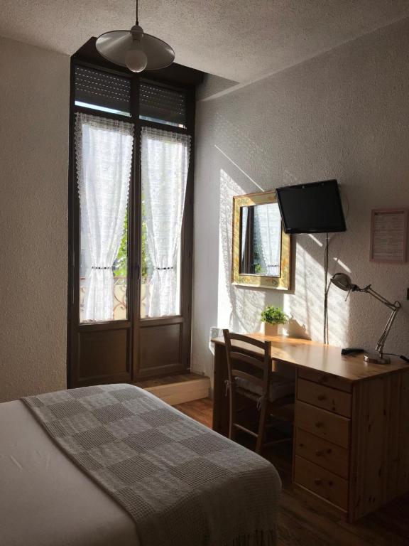 Postel nebo postele na pokoji v ubytování Terminus Hôtel des 3 Vallées
