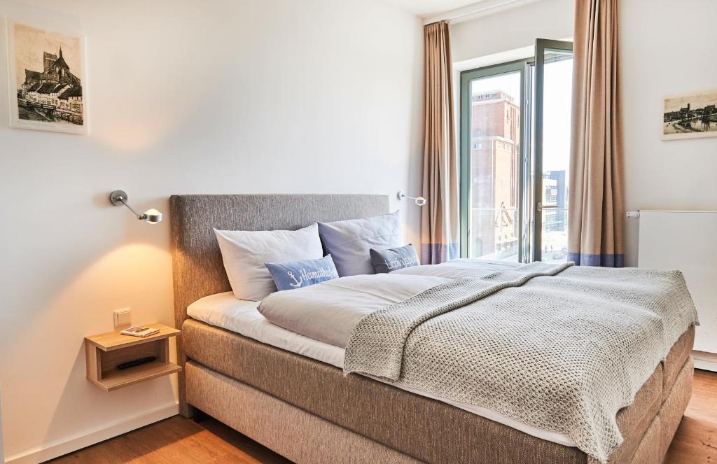 Ένα ή περισσότερα κρεβάτια σε δωμάτιο στο Am Hafen - Ohlerichspeicher