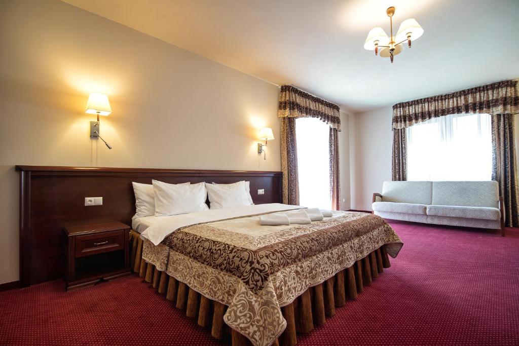 Postel nebo postele na pokoji v ubytování Hotel Kawallo