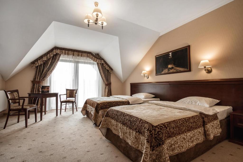 Postel nebo postele na pokoji v ubytování Hotel Kawallo