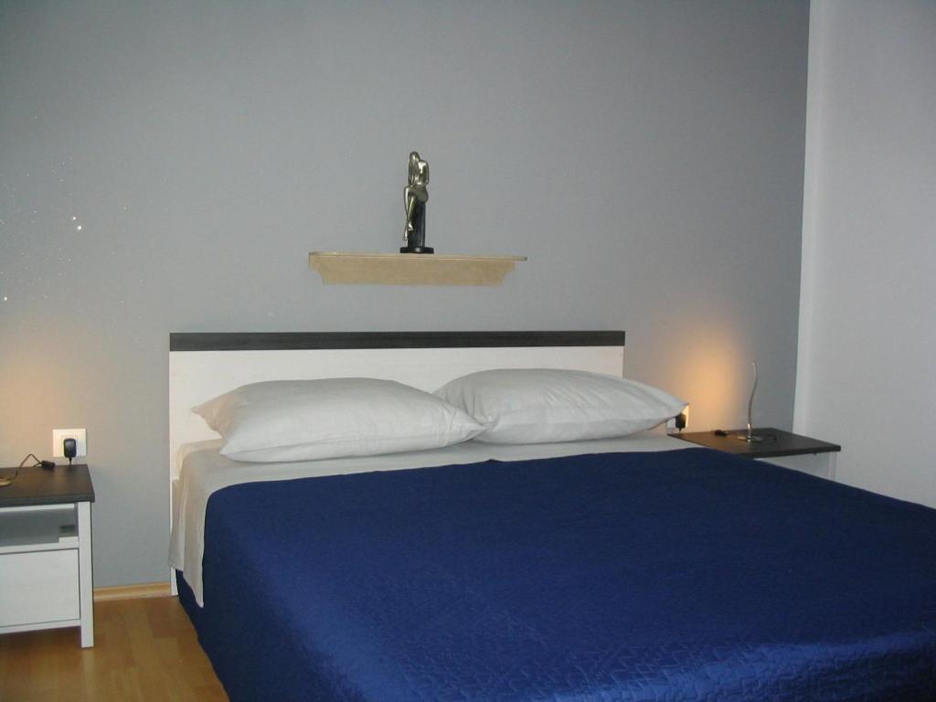 Postel nebo postele na pokoji v ubytování Apartment Amfora on the ground floor