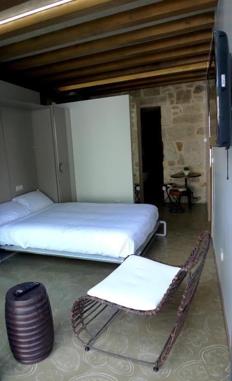 Posteľ alebo postele v izbe v ubytovaní Blanco Apartamentos Turísticos