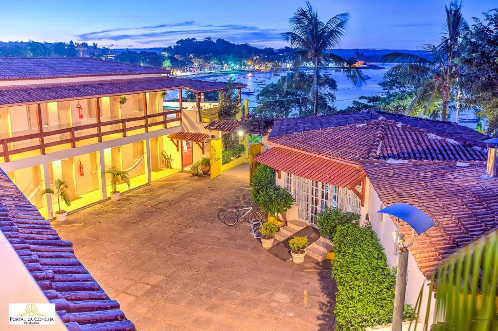 an aerial view of a house with a view of the water at Pousada Portal da Concha in Itacaré