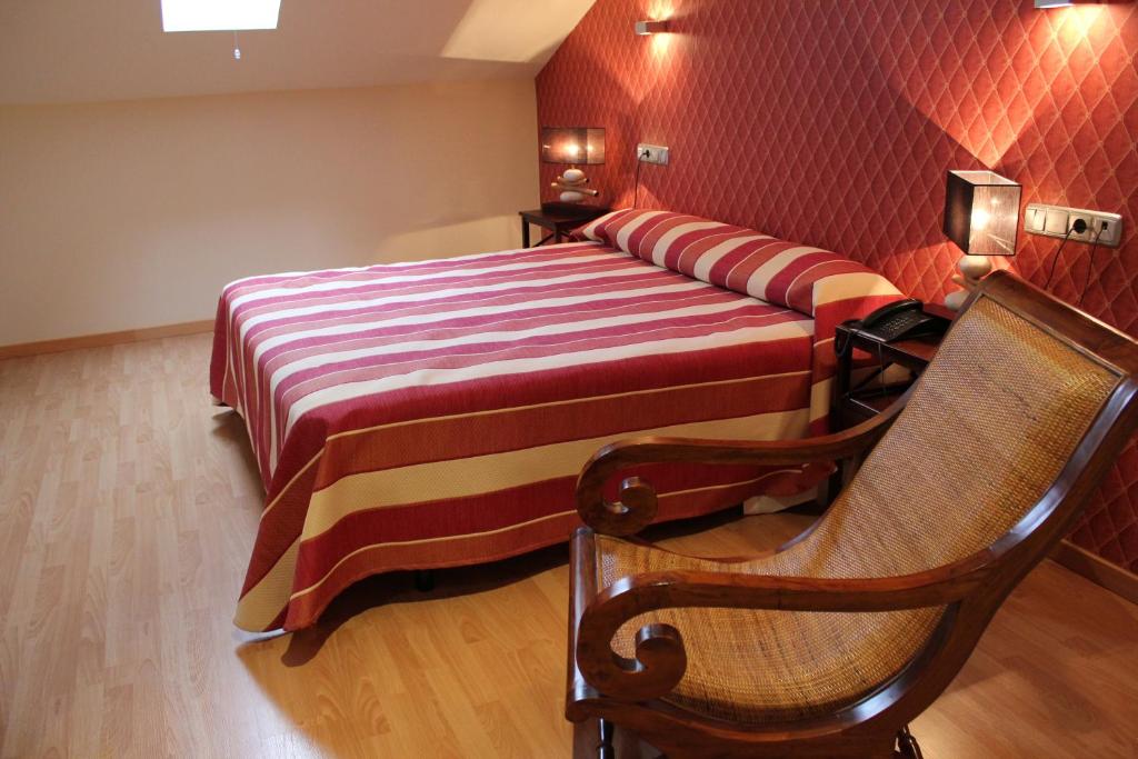 Postel nebo postele na pokoji v ubytování Hospedium Hotel Vittoria Colonna