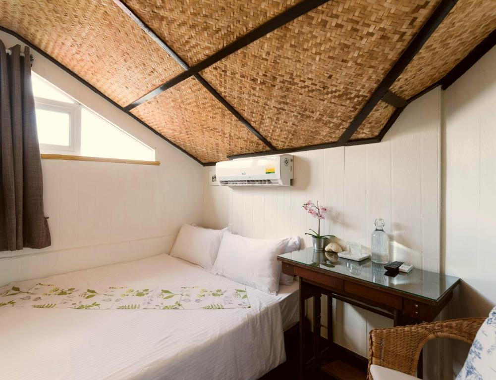 Giường trong phòng chung tại Villa Mungkala