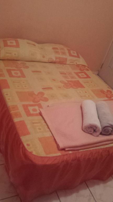Postel nebo postele na pokoji v ubytování Hospedaje Rampolla's