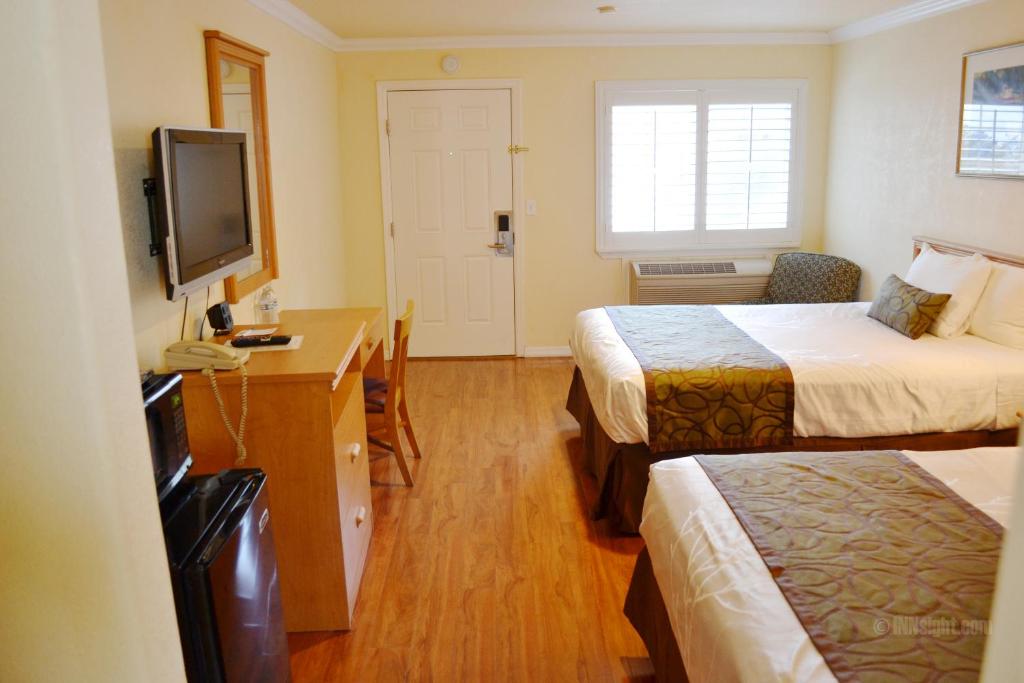 Postel nebo postele na pokoji v ubytování Wittle Motel