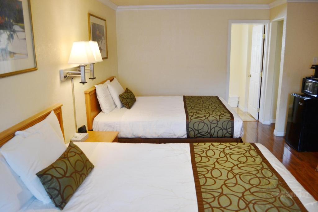 Postel nebo postele na pokoji v ubytování Wittle Motel