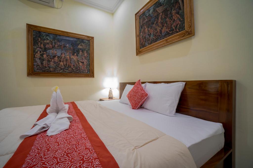 Postel nebo postele na pokoji v ubytování Omank Agus Homestay
