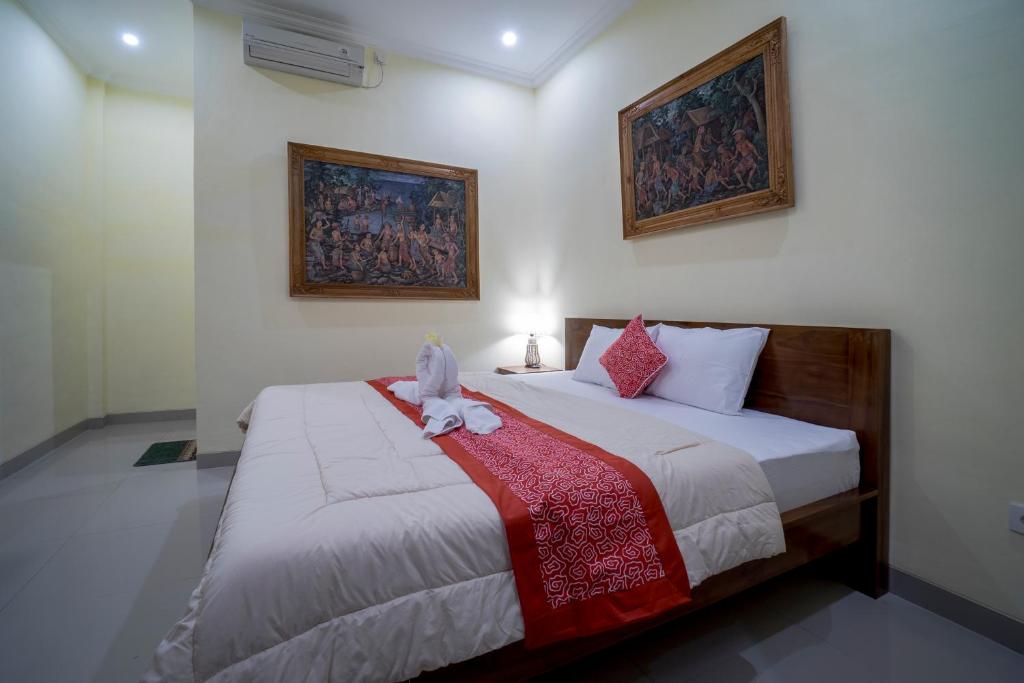 Postel nebo postele na pokoji v ubytování Omank Agus Homestay