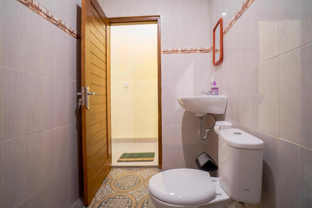 Koupelna v ubytování Omank Agus Homestay