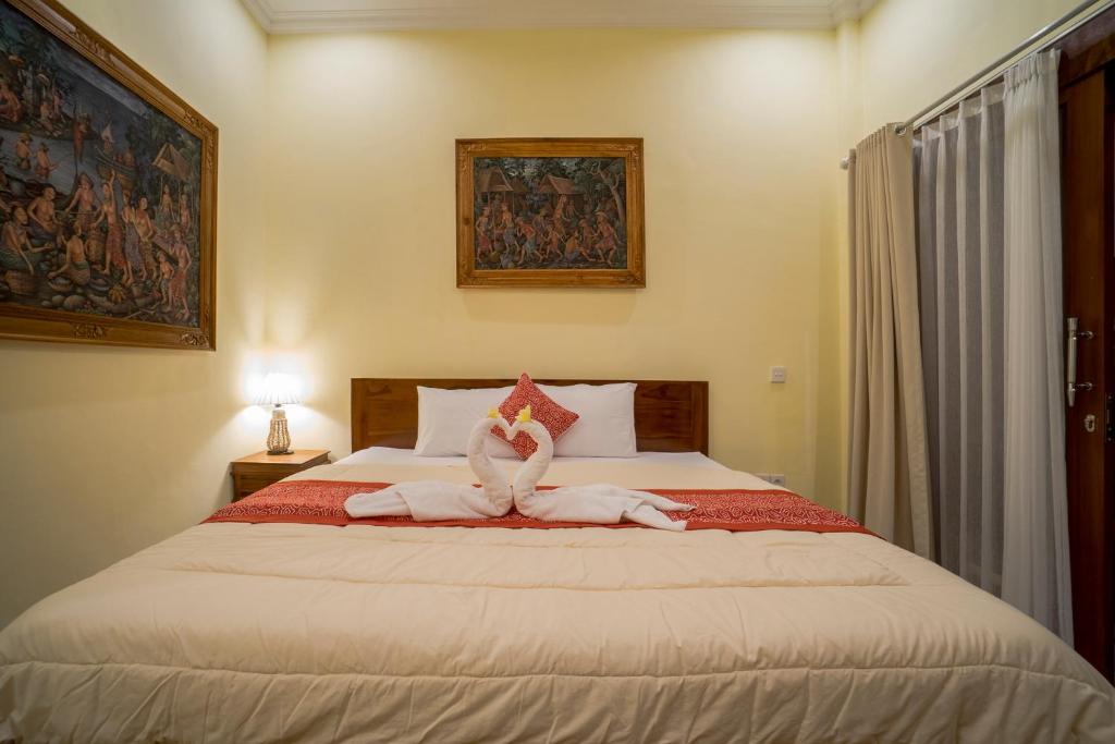 Postel nebo postele na pokoji v ubytování Omank Agus Homestay