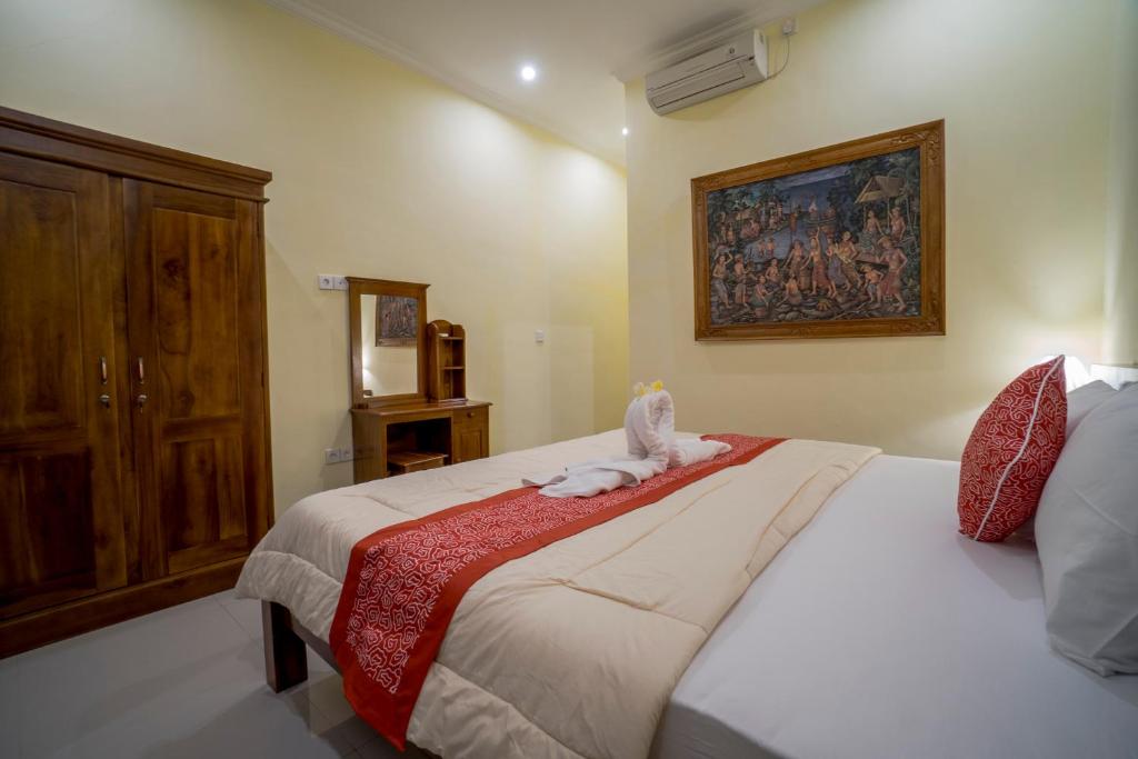 Postel nebo postele na pokoji v ubytování Omank Agus Homestay