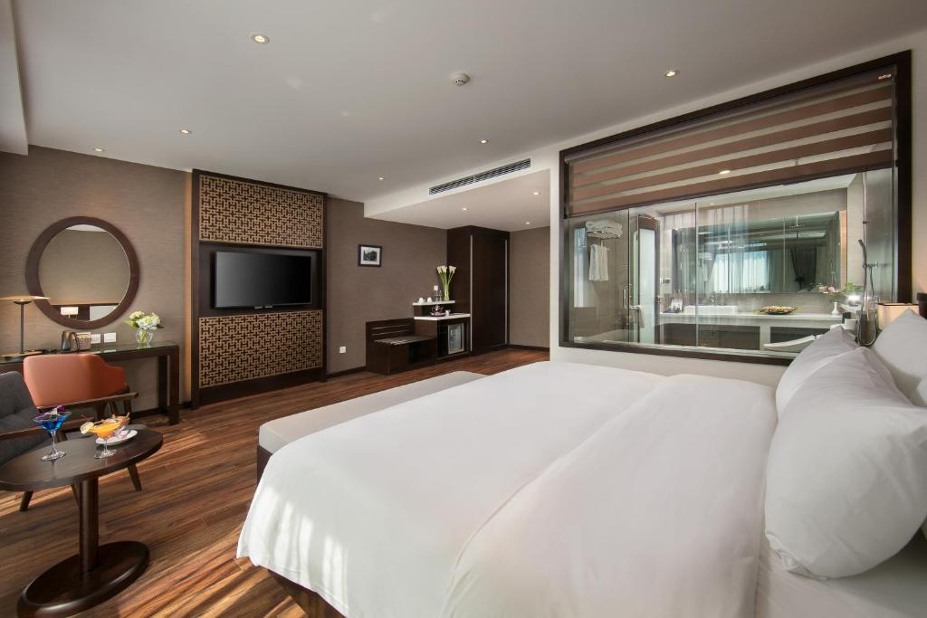 Postel nebo postele na pokoji v ubytování Grandiose Hotel & Spa