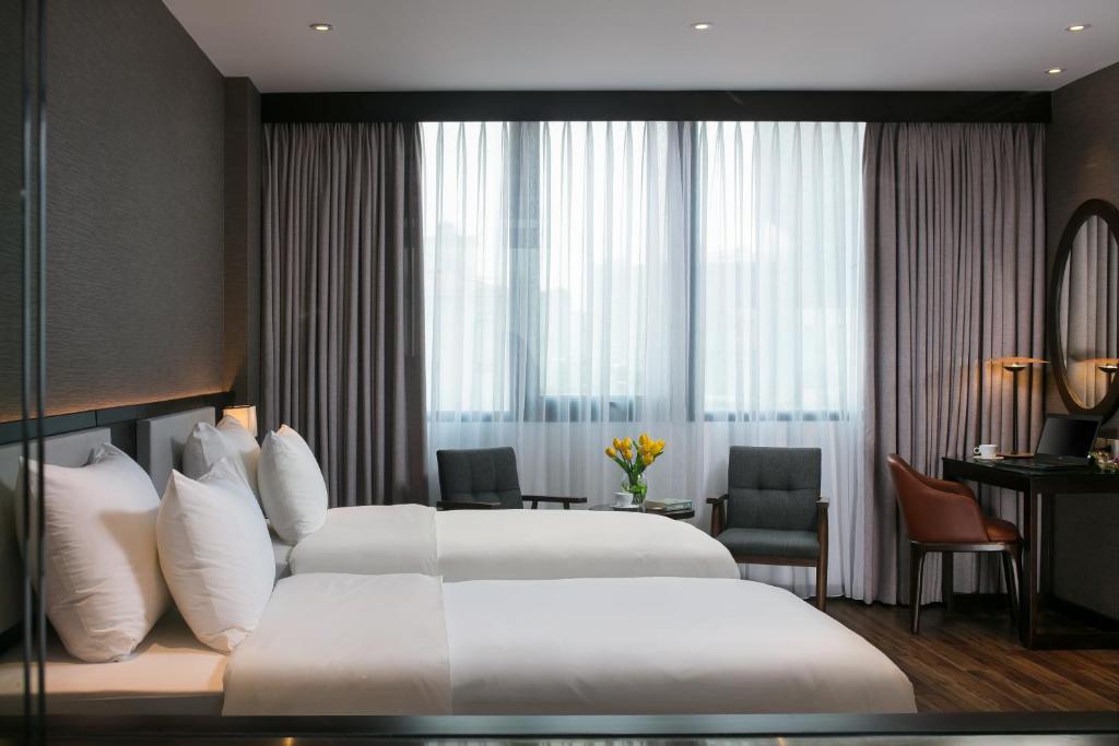 Postel nebo postele na pokoji v ubytování Grandiose Hotel & Spa