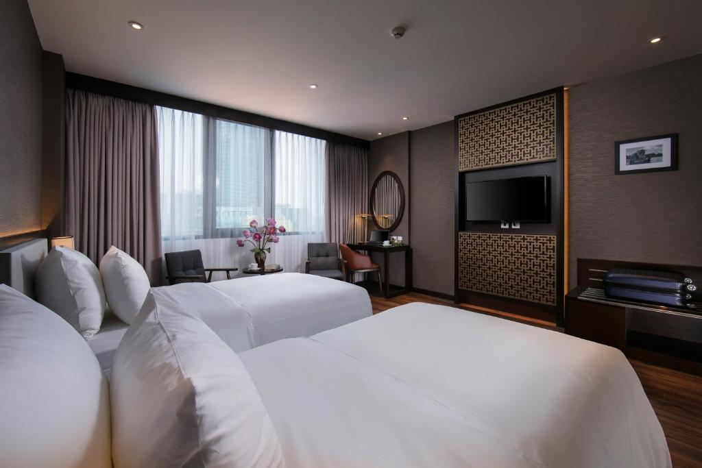 Postel nebo postele na pokoji v ubytování Grandiose Hotel & Spa